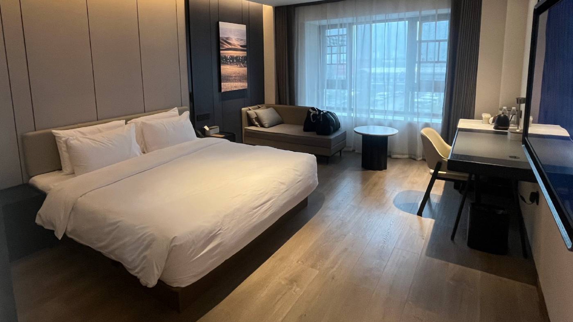 A typical Atour hotel room. Expect spacious rooms, modern interior and desks to work at.