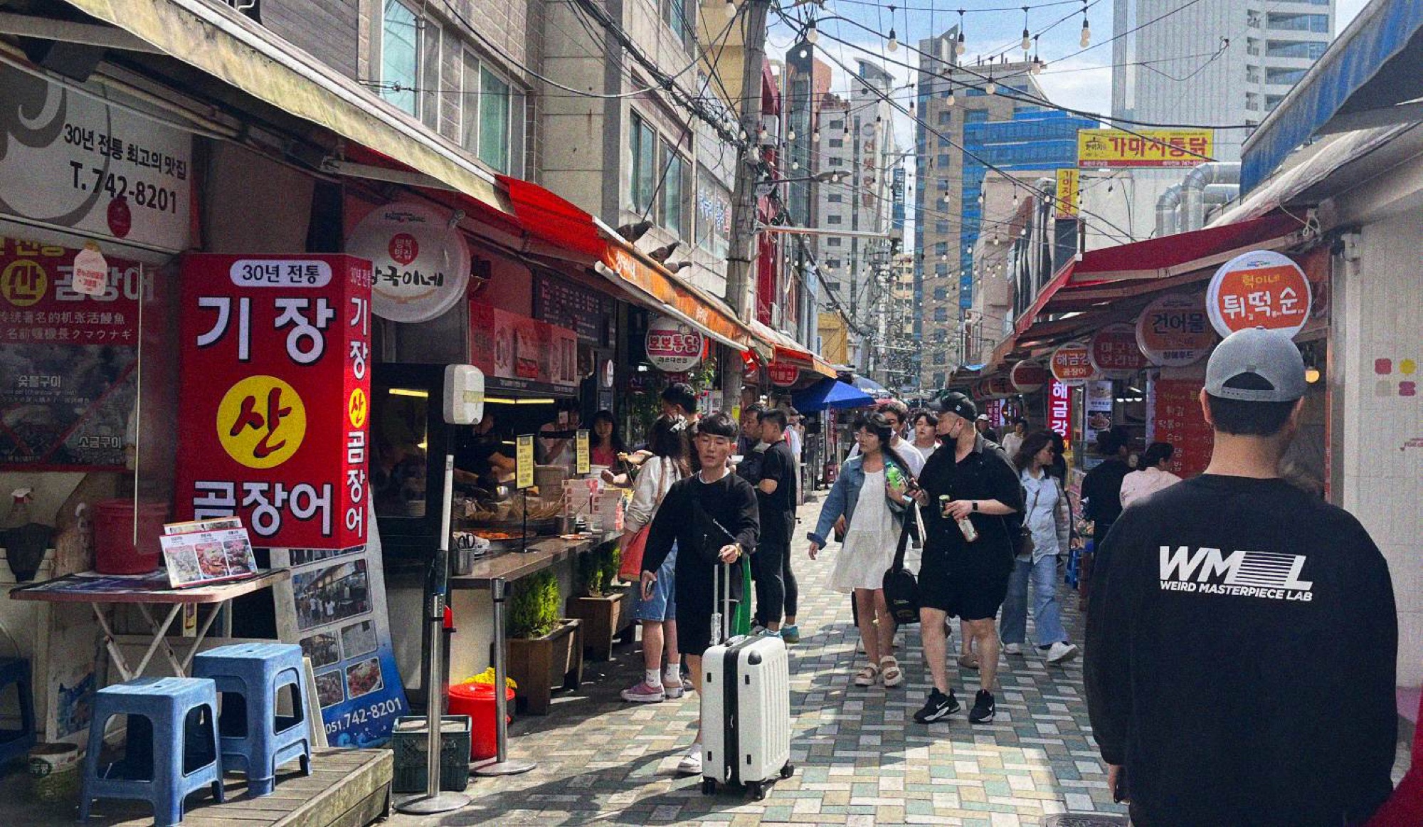 Haeundae Traditional Market, a short walk from the metro station, is lined with eateries serving local delicacies, with seafood featuring prominently.