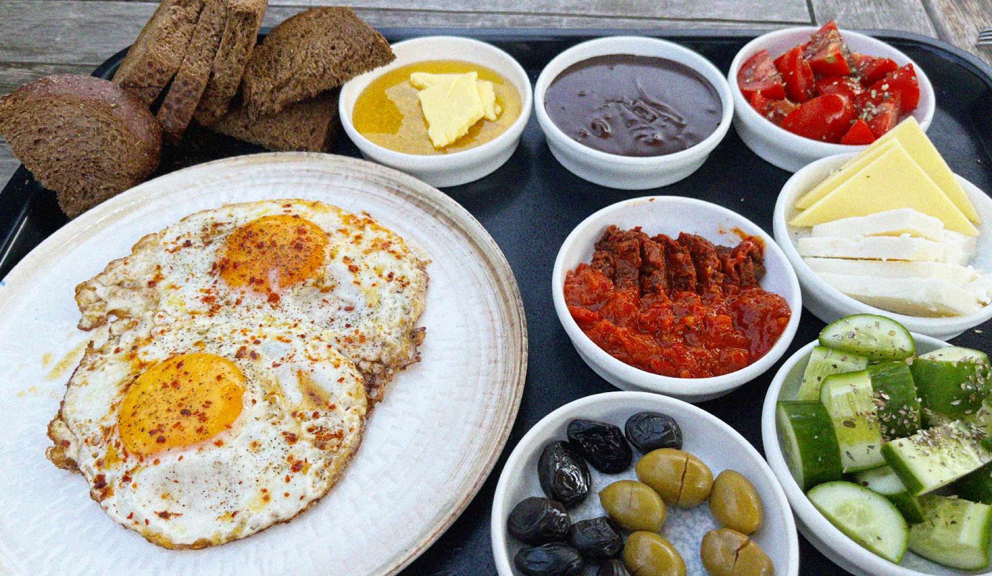 A Turkish breakfast is an essential part of any trip to the country. Expect an assortment of items featuring olives, cheeses, eggs, fresh tomatoes, honey, simit and washed down with plenty of tea. Prepare to be filled up.