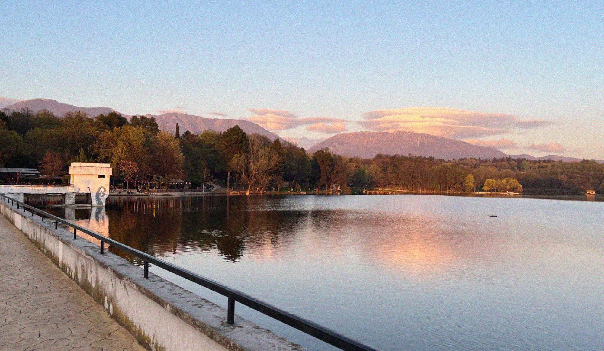Sunset looking across the lake at the Grand Park of Tirana.