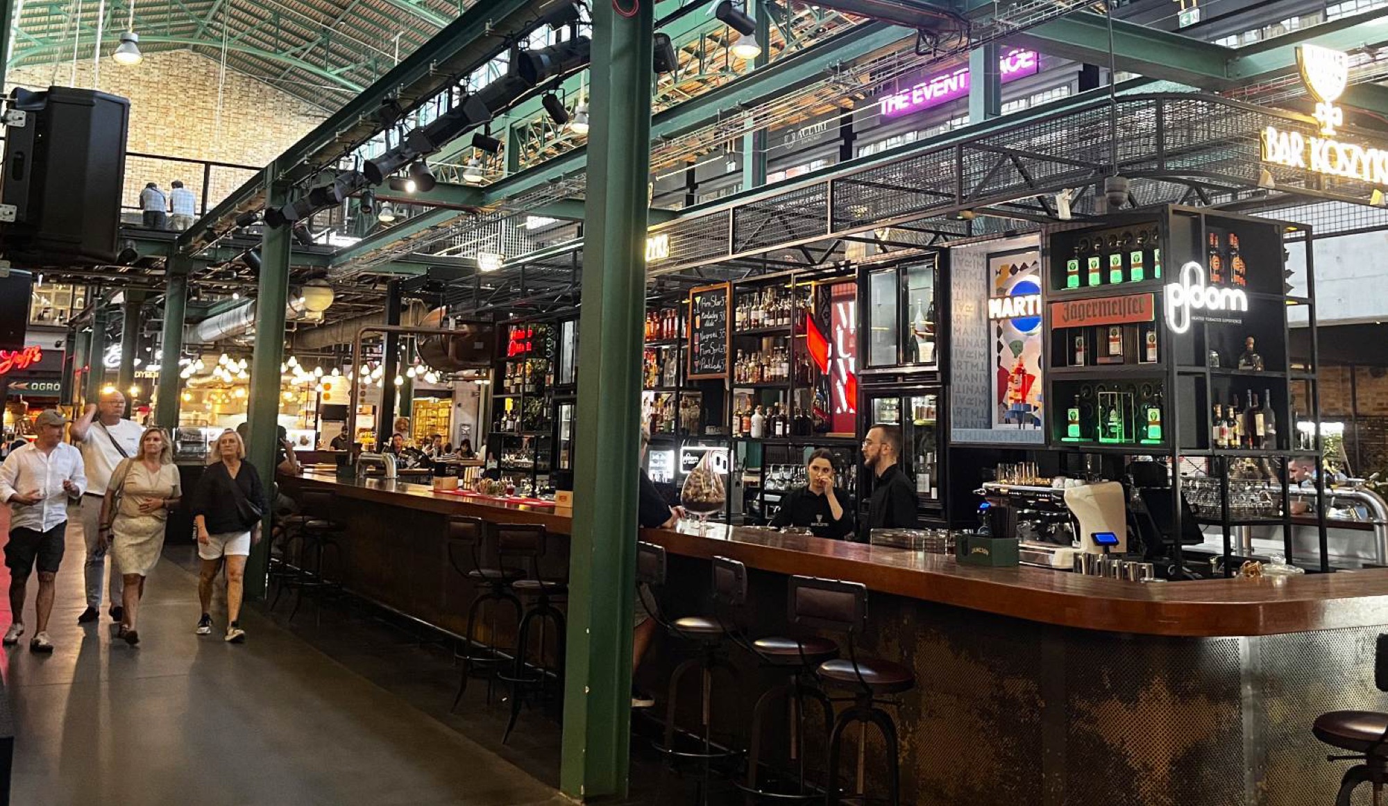 The rennovated market hall 'Hala Koszyki' is one of many recently revistalised former industrial sites which have done a great job of maintaining the original aesthethic with new street food vendors, bars and art installations.
